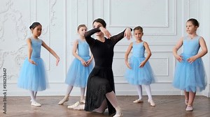 Young girls from ballet dancing ballet in white studio. Pretty graceful ballerinas doing elements of classical ballet - arts concept 4k footage Stock Video
