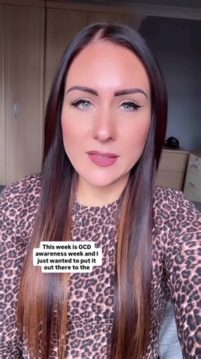 Obsessive-compulsive disorder is a mental disorder in which an individual has intrusive thoughts and feels the need to perform certain behaviors repeatedly to relieve the distress caused by the obsession, to the extent where it impairs general function. We don’t all live like this. We aren’t all “just a little bit OCD..” #Accessibility - Katie with an animal print top on and dark hair down, sat in her bedroom talking to the camera. #Ocd #OcdAwareness #OcdAwarenessWeek #MentalHealth