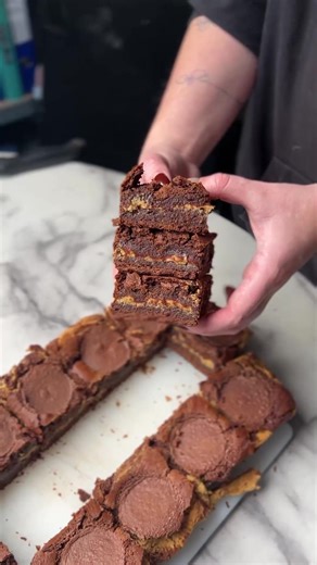 5.3K views · 22 reactions | This is our Reese’s Cup Brownie, layers of gooey brownie and creamy peanut butter, topped with a Reese’s cup too! #bakery #smallbusinessuk #sweet #ridiculouslyrichbyalana #sweettreat #small #cake #treat #treatyourself #businesses #SweetTreats #cakelovers | Ridiculously Rich By Alana | Facebook