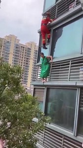 Woman Falls From Building Because of Rescue Team
