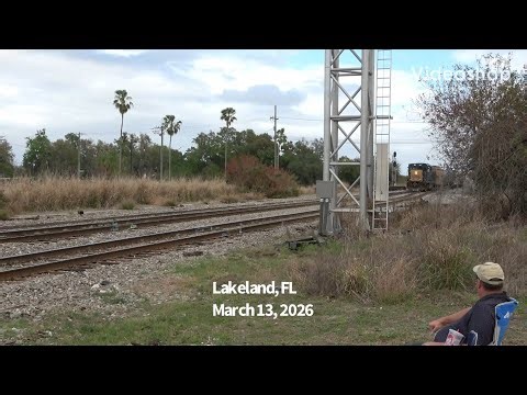 CSX railway local train lets conductor off to hop on caboose. Lakeland, FL.