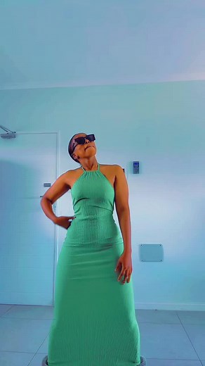Woman Dancing in Green Dress: Fun TikTok Video
