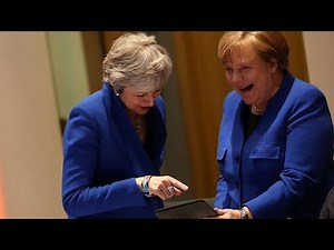 What was on the tablet that had May and Merkel laughing?