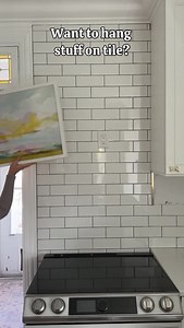 How do you hang things on tile? -drill through the grout lines ✅ -add a nail or screw -hang your item -do NOT drill through the tile if at all possible ❌ That way, if you change your mind, you can grout over the holes and they disappear! 🖼 It’s wayyyyyy easier to drill through the grout than the tile too. Live your decor life without regrets 😇 | At Home with Ashley