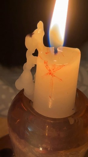 While I was casting a protection spell, a wax figure formed facing the flame with a heart-shaped gap 💖 These little signs show the spell is active, responding and that intentions are manifesting. I absolutely love seeing signs like this during my workings!✨ What energy do you sense and what do you feel it represents? #witchtok #candlemagic #protectionspells #witchesoftiktok #candlemagickforwitches