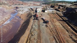 Aerial drone view of an old and rusty remains of the old copper mining exploitation in Minas de Riotinto, used for excavation and transportation of the copper of Corta Atalaya mining exploitation