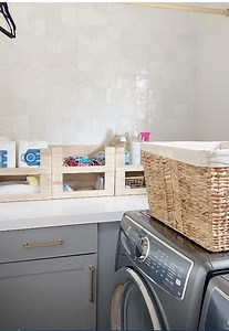 Add easy and effective organizing solutions to your space. 🧺💙 Breathing Room Home used our Water Hyacinth Laundry Basket and The Home Edit Wooden Open Front Bin in Sand to create practical solutions for her client. SHOP: https://container.store/3phpQ7Q at #TheContainerStore | The Container Store