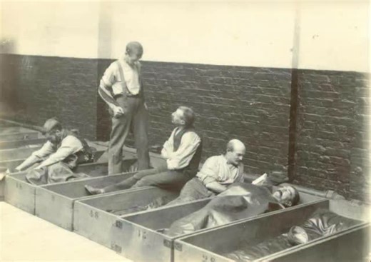Infamous Boundaries on Instagram: "Men sleep in their 4 penny coffin: a way in victorian times to help reduce the homeless problem. For 4 penny one would get a pillow, blanket and coffin. Photo circa 1900. In Victorian Britain the poorest residents of the cities often had only one option for shelter. Charitable groups and municipal lodging houses introduced what became known as a four penny coffin. It was a crude wooden box just long enough to lie in with a thin blanket and a small pillow. For m