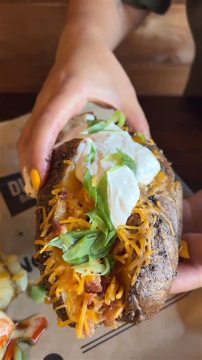 Dickey's Barbecue Pit Official on Instagram: "GIANT PIT-SMOKED LOADED BAKER from @dickeysbarbecuepit! 🥔🔥🧀🤤 Packed with melty cheddar, crispy bacon, cool sour cream, and fresh green onions - SMOKED low and slow for that perfect bite. Who’s grabbing one? 💪 #PitSmokedPerfection #DickeysBBQ"