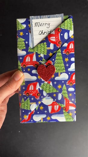 Kate on Instagram: "This isn’t just gift wrap — it’s part of the gift 🎁❤️ A handmade Christmas envelope made from paper, with love and a little holiday magic. Would you keep this wrapping? 🎄✨ #ChristmasDIY #GiftWrappingIdeas #HandmadeChristmas #CreativeGifts #PaperCraft #HolidayDIY #ChristmasGiftIdeas #DIYEnvelope #HandmadeWithLove"