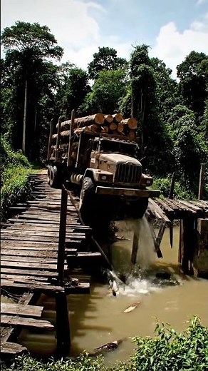 Watch a Fully Loaded Log Hauler Break a Bridge!