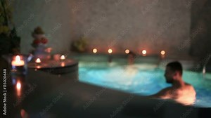 couple on a date at the beautiful swimming pool in the sauna