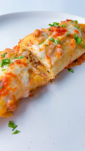 Snejana Andreeva on Instagram: "I know you’ve had Lasagna but have you had crepe lasagna rolls(crepe cannelloni)? My moms meat filled crepes with bechamel sauce and cheese are what lasagna dreams are made of. This savory crepe recipe is so good and you probably won’t be able to tell that they’re not made with actual lasagna sheets. This recipe was the best experiment and accidentally made by my mom right before Christmas. She went out to find cannelloni in Bulgaria but didn’t have any luck. She 