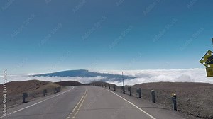 Volcano road from Mauna Kea Observatory drive POV Hawaii. Most active volcano in the USA. Smoke, steam, gasses. Big Island in Volcano National Park. Geological crater tourism destination for science.