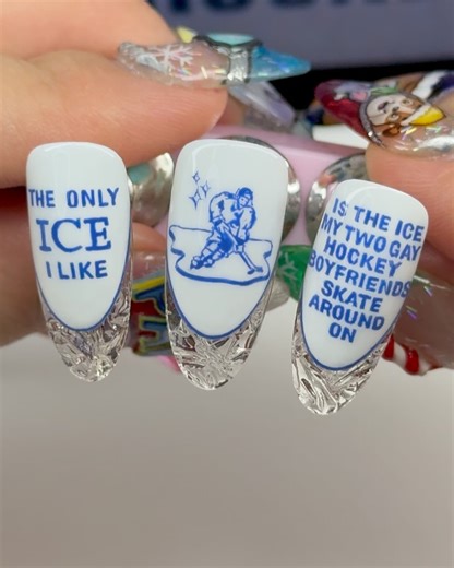 Madison McCollough on Instagram: "oop 🧊✨ #heatedrivalry so these went super viral yesterday and there were a lot of mixed opinions! sorry if they offended you, please work on yourself so it doesn’t happen again 💕 design inspired by @goodshirts all nail products used from @ballpit_shop! i used our Blue Raspberry Paint Ball (potted art gel) & Double Trouble liner brush for the ultra crisp text ✨ #ice #nailart renee nicole good, ice, heated rivalry, nail design, ice nails, ice nail art, us politi