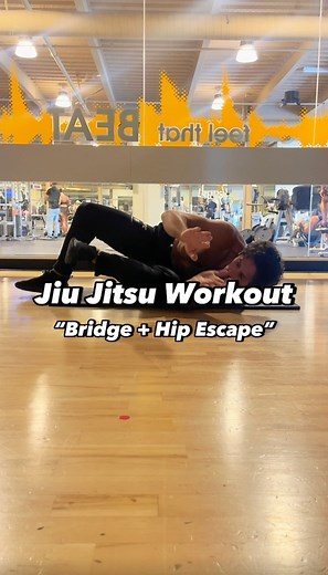 Jiu Jitsu Workout. “Elbow Bridge Sliding V Frame Hip Escape”. We’re doing an elbow bridge and opposite side sliding v frame hip escape here. These are two fundamental movements from bottom mount and make for a great workout. 1-3 sets of 10 on both sides. #jiujitsuflo #jiujitsu #bjj #brazilianjiujitsu #grappling #mma #martialarts #mobilitytraining #bodyweighttraining #homeworkout #fitness #workout #exercise #calesthenics | Jiu Jitsu FLO