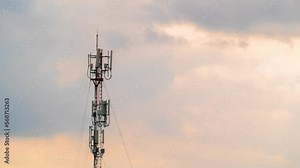 Time lapse of moving clouds over a 5G mobile tower. High-speed Internet and telecommunications. Connection and remote access to knowledge in online access. The future of communication between people.