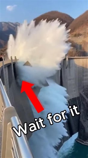 ANY MEDIA on Instagram: "Dam Suddenly Breaches at Tourist Viewpoint, Sending Visitors Fleeing A peaceful afternoon at a popular tourist viewpoint turns into sheer panic when a dam catastrophically fails captured in chilling detail on a handheld smartphone. The video begins with visitors calmly enjoying the scenery, taking photos and admiring the massive structure below. The atmosphere is relaxed until a deep, ominous rumble cuts through the air. The camera swings toward the dam just as one secti