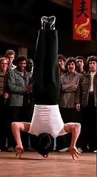 Bruce Lee Does The Impossible Upside Down Two Finger Push Up