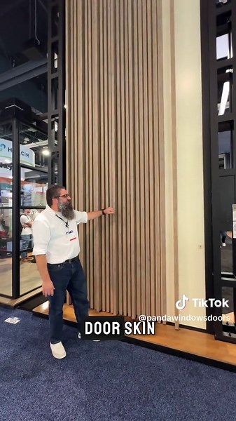 ICYMI: Check out our massive 18-foot tall Voyage Pivot Door! 😍 Featuring aluminum cladding that mimics real wood grain, a double recessed handle with built-in lighting, and a smart lock that unlocks with just a fingertip! 🤳Talk about innovation and style! #architecture #modernliving #innovation #luxury #construction #homedesign #door #smartlock #homegoals #architecture #interiordesign #fyp