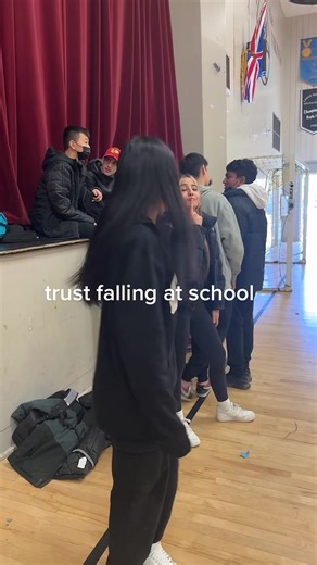 Trust Fall Activity for Students in Gymnasium
