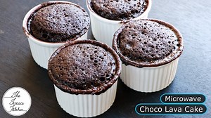 Many of you had requested for a choco lava cake in a microwave. So, here I bring you this perfect recipe. If you wish to make this in a Kadhai, Cooker or OTG; just follow the instructions and Enjoy!! [INGREDIENTS] 1/2 Cup All purpose flour (maida) 6 Tbsp Powdered sugar 2 Tbsp Cocoa powder 1/2 Tsp Baking powder 1/8 Tsp Baking soda 1/2 Cup Milk 2 Tbsp Oil Chocolate Ganache (made using 1/2 Cup chocolate 1/4 Cup cream/3 Tbsp milk) OR You can also use pieces of chocolate 1 Tsp Vinegar or 1 Tsp Lemon 