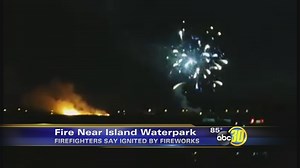 Grass fire sparked by fireworks burns near Island Water Park