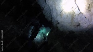 Diver in underwater cenotes in the Yucatan Peninsula.
