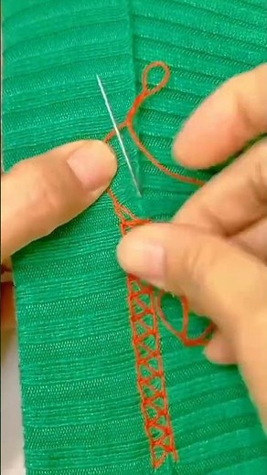 making crafts by sewing thread onto cloth