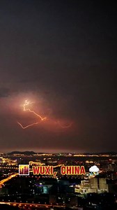 A mesmerizing blend of sunset hues🌅, city skyline🏙️, and a dramatic thunderstorm⚡️ in #Wuxi, China. #VisitWuxi | Wuxi, China