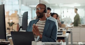 Call center, smile and support with agent man in customer service office for assistance or help. Contact us, headset and computer with virtual helpdesk employee in workplace for lead generation