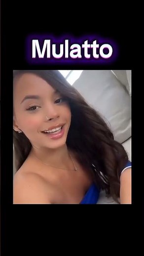 Mixed / Mulatto woman embraces both sides of her (Mixed Race) heritage equally.