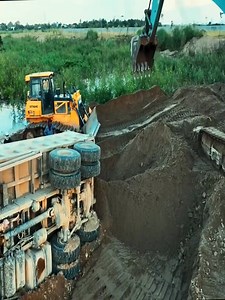 A dangerous scene of land reclamation by filling in a lake; a massive land reclamation project. | Robiul Islam