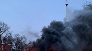 Firefighting helicopter water drops. Aerial firefighting technology in action. Water bomber firefighters