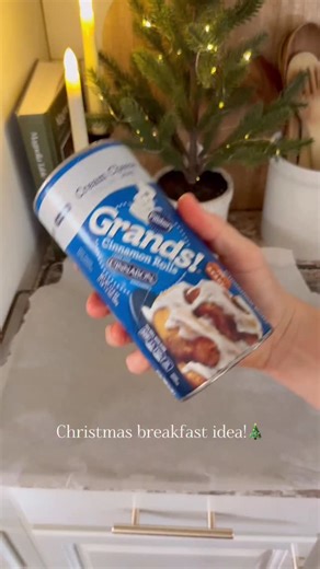 Christmas tree cinnamon rolls!🎄🎄 These are so simple to make and perfect for Christmas morning breakfast! My kids loved these last year!🎄🎄 I just opened a cinnamon roll and shaped it into a Christmas tree. Then I baked them, iced them, and topped them with pearl sprinkles to look like ornaments! #christmastime #christmas #christmasbreakfast #christmasfood #christmasbaking | Our Winton home