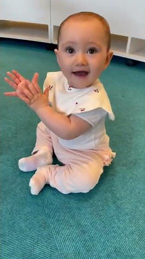 9 months old baby clapping hands