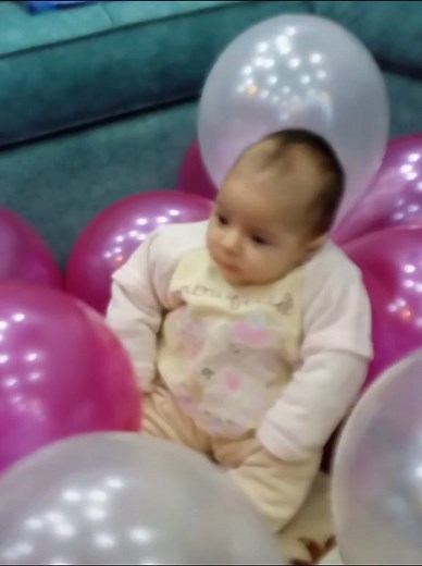 Baby Unicorn Celebration with Colorful Balloons