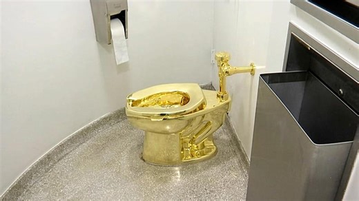 Solid gold toilet sells for $12 million at auction