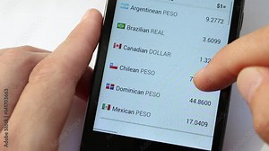 Exchange Rates Display In Smart Phone. Foreign exchange market. Fluctuations in exchange rates. List of circulating currencies by state or territory