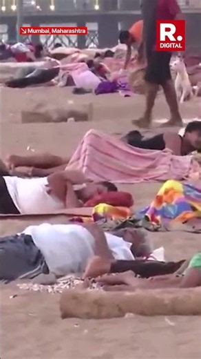 WATCH: Intense Heatwave & Power Cuts Force Mumbai Slum Residents to Sleep on Versova Beach