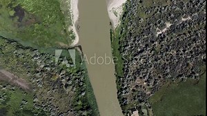 Aerial view on the branch river is a (Danube river) flowing into the Black Sea, Danube Biosphere Reserve in Danube delta. Camera moving forwards and up, 4K-60fps. Danube river, Odessa oblast, Ukraine