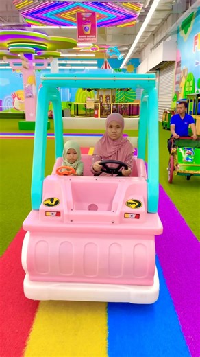 Wheels on the pink bus round and round