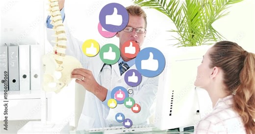 Dr using spine model clinic showing lumbar area causing rising likes hiding torso patient watching