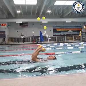 Bob Evans (USA) stayed afloat whilst keeping these 5 juggling balls dry! | Guinness World Records