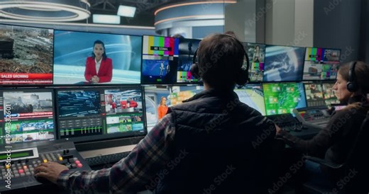 Backstage TV Station Production Control Room Operators Manage a Live News Broadcast, Switching Studio Feeds, Monitoring Industrial, Business News Coordinating Channel Output Across Monitors