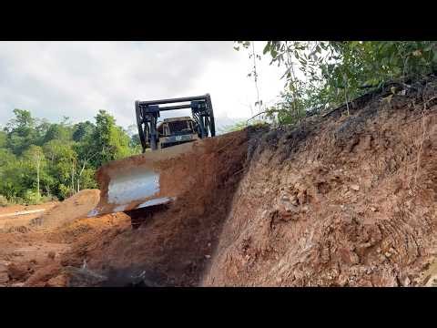 The Power of the CAT D6R XL Bulldozer Splits Hills for Forest Road Construction