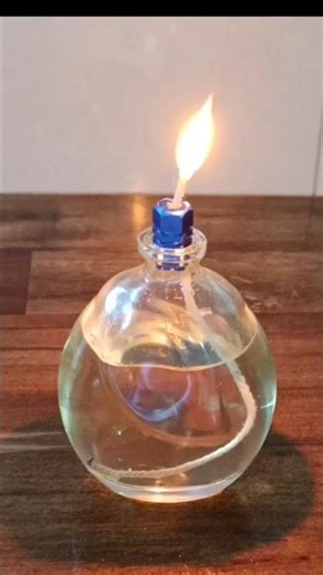 "A perfume bottle and oil turned into a bright camp lamp."