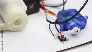 Micro servo activating the toggle switch with its horns. Servo used as a switch to turn on and off other electronic components like small pump Stock Video