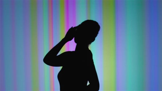 Shadow of a dancer during a colorful performance - Free Stock Video