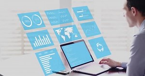 Businessman analyzing business analytics chart metrics and financial report on augmented reality (AR) holographic technology screen on computer. 4K video